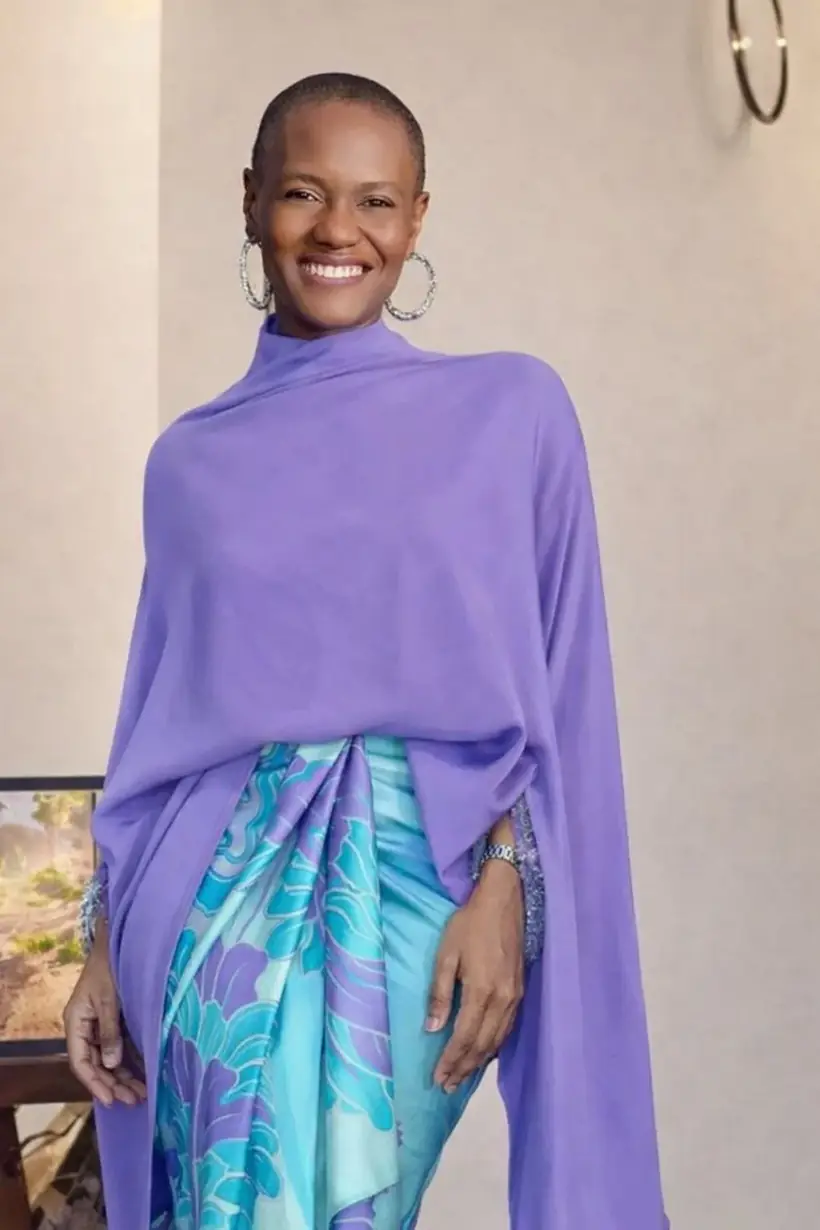 Celeste Angelic London in a lavender and turquoise outfit